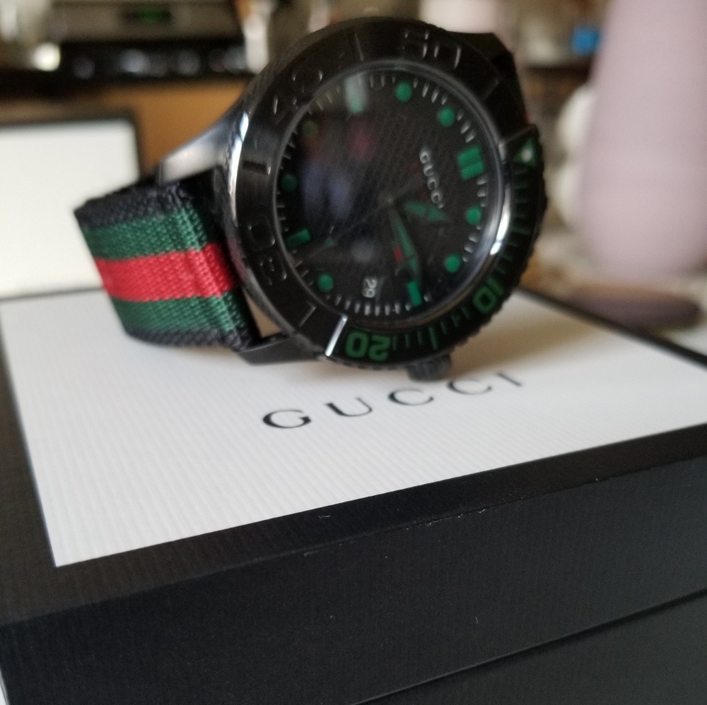 Gucci timeless watch back steel canvas strap.